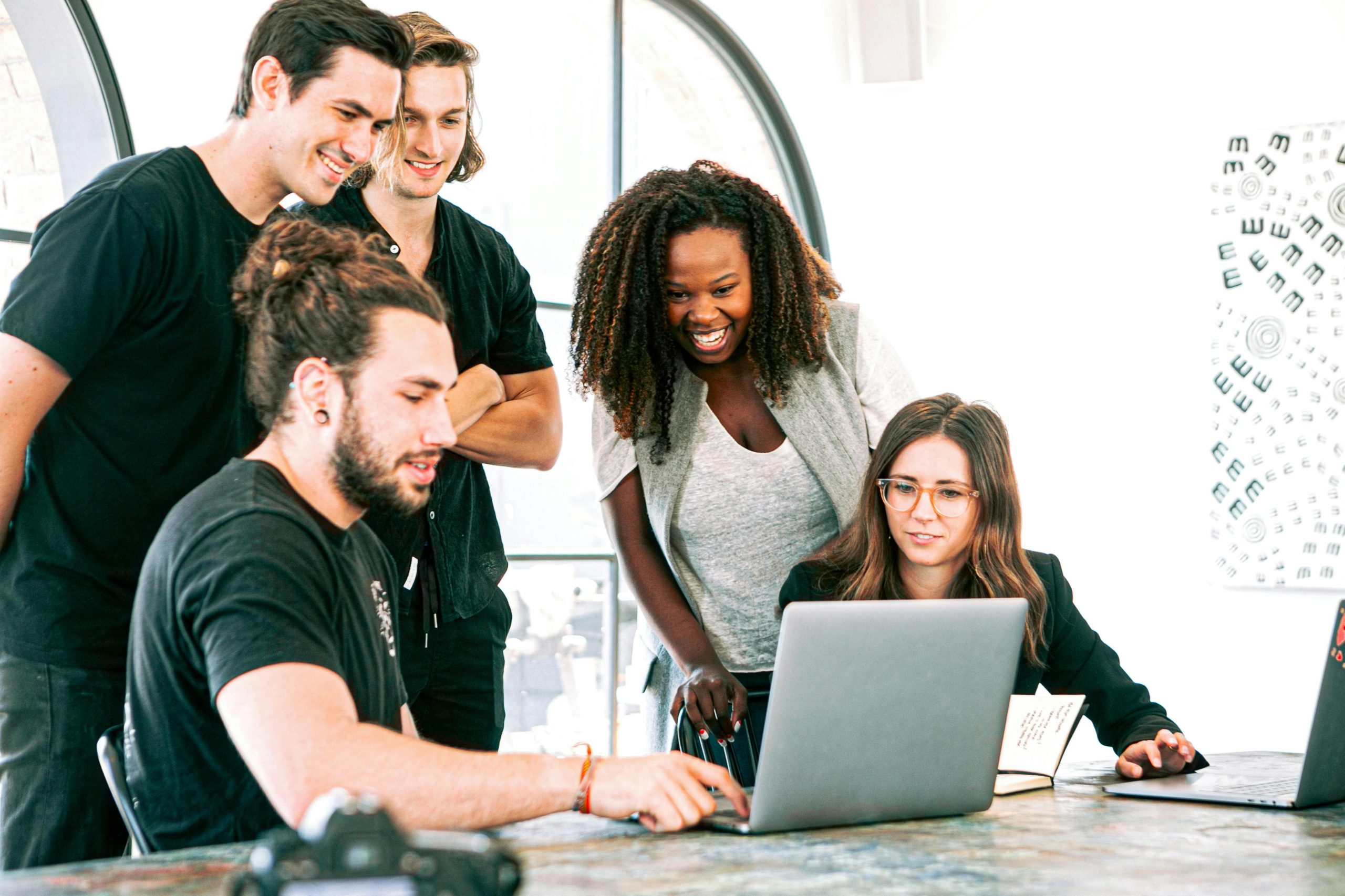 Business professionals sharing humour across cultures during a meeting